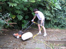 [Steven Mowing the Patio]