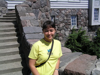 [Steph on the steps of the lodge]