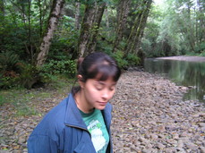 [Blurry Photo of Steph by a Creek]